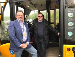 Councillor Barry Lewis and Luke Layton boarding a bus