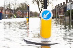 road sign on flooded road