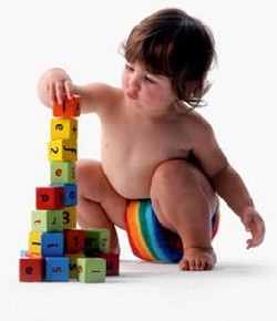 young child stacking building bricks