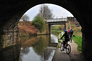 People cycling by Chesterfield canal